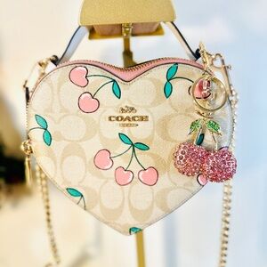 Coach crossbody with cherry hearts and pink cherry charm (charm not coach)